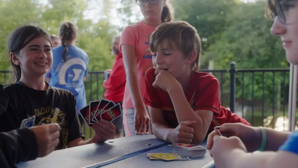 Campers playing cards between sessions at International Judo Camp