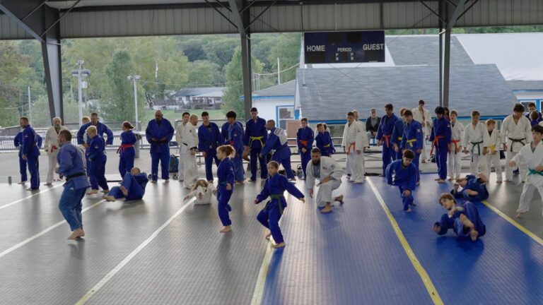 Wide view of randori under the open-air pavilion at International Judo Camp